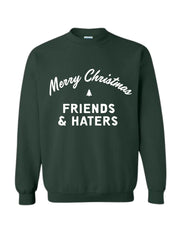 green crewneck sweatshirt with "Merry Christmas Friends & Haters" printed on middle front of sweatshirt in white writing. 