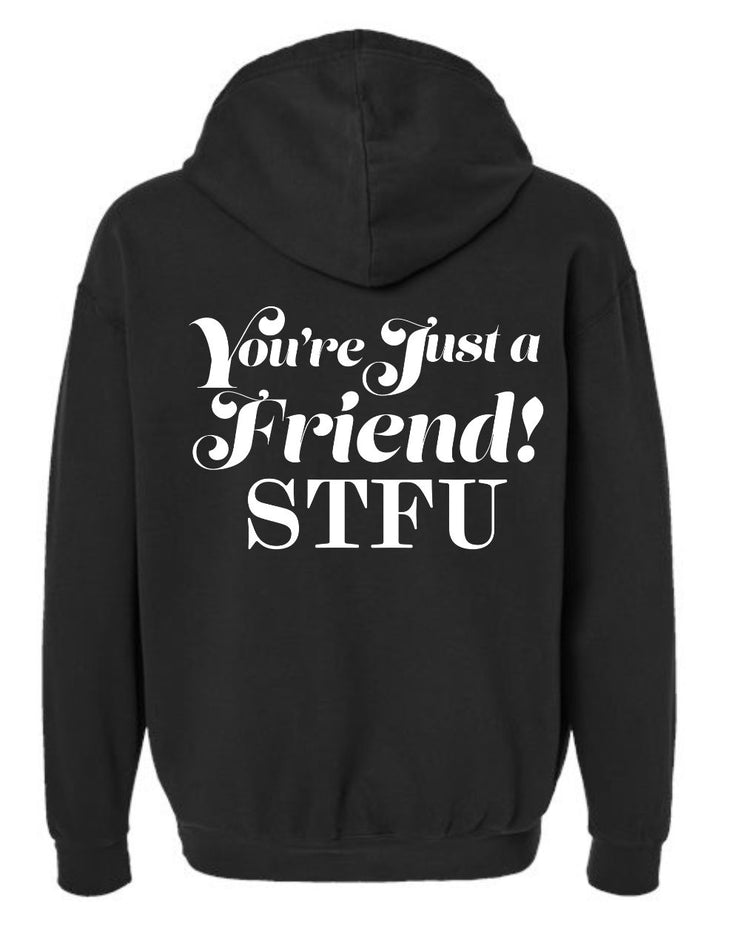 Picture of the back of a black hoodie with the words "You're Just a Friend! STFU" written in large white font on the back of the sweatshirt. 